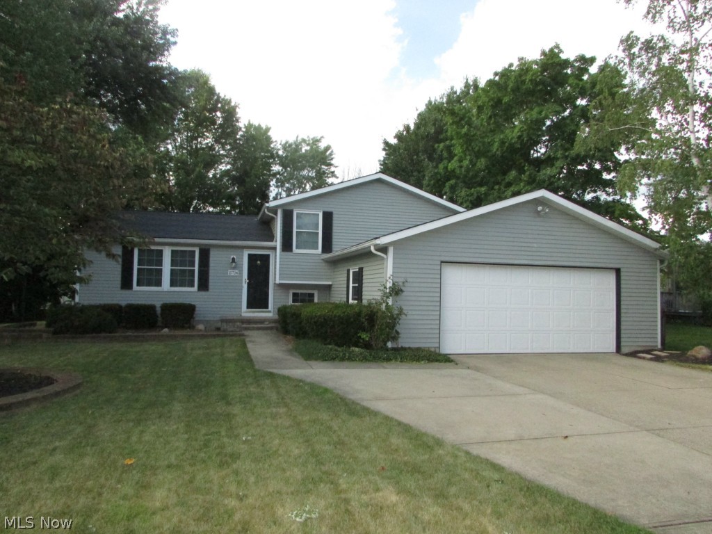 An exquisite 4 level split on a quiet Strongsville street.   With 3 beds and 2 full baths, this lovely home features cork floors throughout the main level living area.  The updated eat-in kitchen has newer granite counter tops and stainless steel appliances.  A 23x20 Family Room features a delightful pellet stove.  Both bathrooms are completely updated.  The back yard is extremely private, and has a very large deck and fire pit.  There is a heated 2 car attached garage, partially finished lowest level that has a transferable waterproofing warranty, laundry area, newer windows, and so much more.