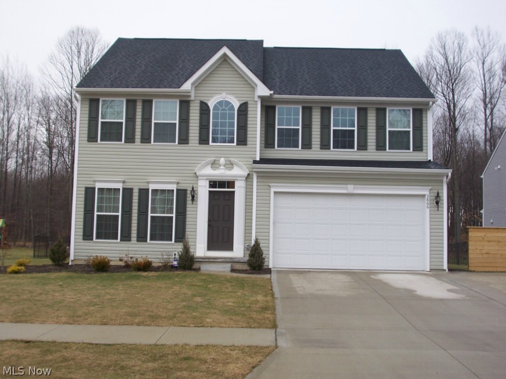A remarkable colonial in Whispering Woods in Brimfield.  This home was built with many upgrades.  The kitchen has 42" cabinets, granite counter tops, wood floors, stainless steel appliances, and a large pantry.  A morning room with large windows makes a comforting setting.  The huge great room has a fireplace with stone all the way up to the 18' ceiling.  The wood floors spread throughout the foyer, kitchen, morning room, and hallways.  The finished basement adds approximately 625 additional square feet of livings space, with an egress window for safety and is plumbed for an additional bathroom.  The 19x17 master suite has double sinks with granite counter top.  Each bathroom has granite counter tops.  The rear yard is completely fenced in with a large shed.  This wonderful home is on a cul-de-sac, with 2 car garage with ample storage, an additional pad for parking, and a private lot.