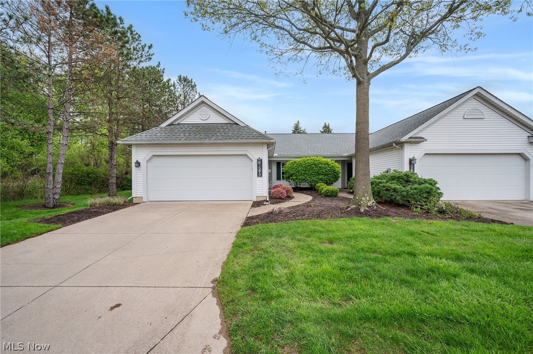 Welcome to this stunning low maintenance ranch style cluster condo. This END UNIT is tucked away in the back of Wildflower Subdivision in North Ridgeville. so many features in this sparkling clean 2 BedRm, 2 Full Bath home! The primary bedroom provides an ensuite w/walk in shower and walk in closet. The secondary BedRm. is next to the 2nd Full bath for convenience. You will be impressed by the open floor plan. The eat-in kitchen includes all NEW stainless steel appliances, pantry and ample space for dining. Enjoy your morning coffee while looking out the kitchen window and views of trees/wooded lot. In addition, there is a pass through for ease to the formal dining room when entertaining. The living room is spacious with vaulted ceiling and a wall to wall sliding glass door that provides natural light throughout the main living area. The back patio is cemented and provides additional living space for those warm seasonal months. From the front door to the back patio door and throughout this home has been professionally painted with neutral colors including walls, doorways and baseboards. ** (Two Rooms Not Included- Kitchen & 2nd Bath) ** New carpet has been installed in the living room and both bedrooms. The 2 car garage includes a cold water spicket, shelving unit and additional storage in the attic ceiling for seasonal items. Door that leads into the house from the garage is one small step for ease when taking in groceries! In addition you will find a large coat closet and a laundry room with utility tub and shelves above the washing machine and dryer. This is move in ready! don't miss this lovely home and all it has to offer!  **Home is being Sold As Is ** Cinch Home Warranty is in place.