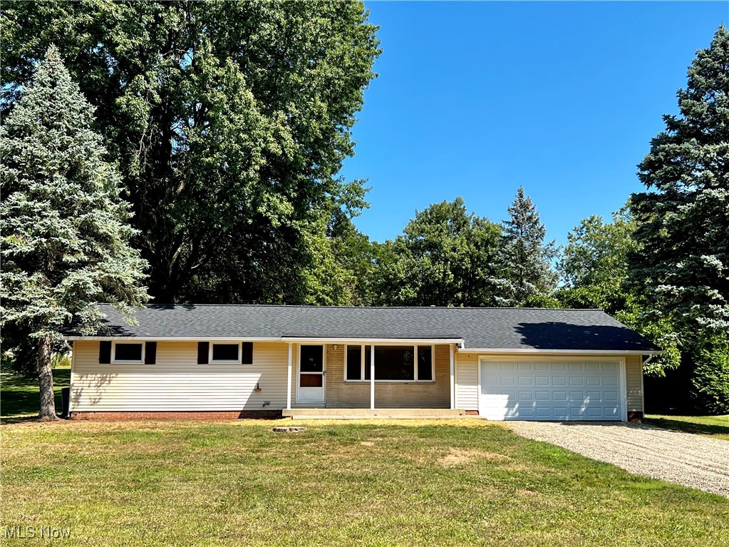 Great opportunity here with this 3 bedroom ranch home on nearly half an acre with a country like setting !  Beautiful hardwood floors, new roof, fresh paint throughout the interior, nice room sizes, gas heat, central air, city water and sewer!  Spacious bathroom with built-ins and partially finished lower level with potential 4th bedroom.  Oversized 2 car attached garage with access to the large park-like backyard w/patio.  Other updates per seller include: Roof 8/2024, HVAC 2014, HWH 2020, Garage overhead door 9/2024, Gravel driveway 9/2024, Landscape update 9/2024 and more.  Refrigerator in garage stays.  Make Offer today-won't last!
