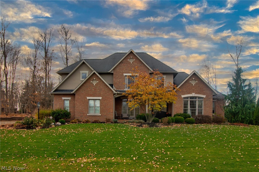 Completely a custom home in one of the area’s most prestigious communities. From the moment you walk in the door you will be amazed! The living room boasts cathedral ceilings, a gas fireplace, and oversized windows looking out onto the patio and in-ground pool. The open concept kitchen is great for entertaining with high end appliances, floor to ceiling cabinetry, and casual dining area with fireplace. Cozy up in the large first floor master with double sided fireplace. The finished basement is a true oasis featuring a gym, lounge area with built ins, custom lighting and gas fireplace, restaurant quality bar, and wine cellar. There is even a 5th bedroom with attached bath and heated floors!