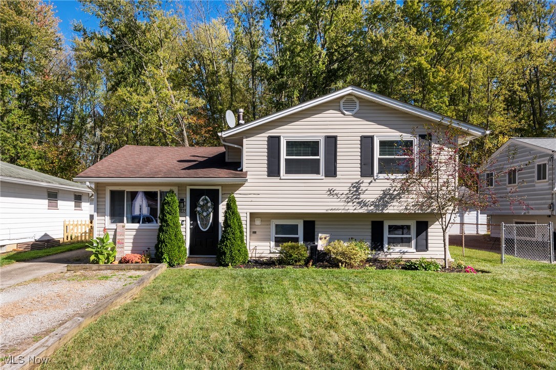 Welcome to 5835 Broad Blvd in North Ridgeville, (open house Saturday, October 18th from 1-3), a clean and well-maintained split-level home with numerous recent updates. Step into the spacious living room with high ceilings that flows into the dining area. The eat-in kitchen features white cabinetry, including a pantry, granite countertops, a movable granite-topped island table, and all newer stainless steel appliances--which stay with the home. Luxury vinyl flooring with a wood-look finish enhances both the first floor and lower level. From the kitchen, sliding glass doors lead to an outdoor patio and a generously sized, fenced-in backyard with a fire pit--perfect for entertaining. Upstairs, you'll find three comfortably sized bedrooms with newer carpeting, including a primary bedroom that easily accommodates a king-sized bed. A tastefully updated full bath completes the upper level. The lower level offers a cozy family room for relaxing, along with a roomy half bath and laundry area. A detached two-car garage, longer driveway, and additional gravel parking area provide space for at least six vehicles. Seller is providing a $597 one-year Cinch Home Warranty. Conveniently located with easy access to I-90 and I-480, and just 10 minutes from Crocker Park, Avon Commons, and Great Northern Mall, this move-in ready home won't last long--schedule your showing today!