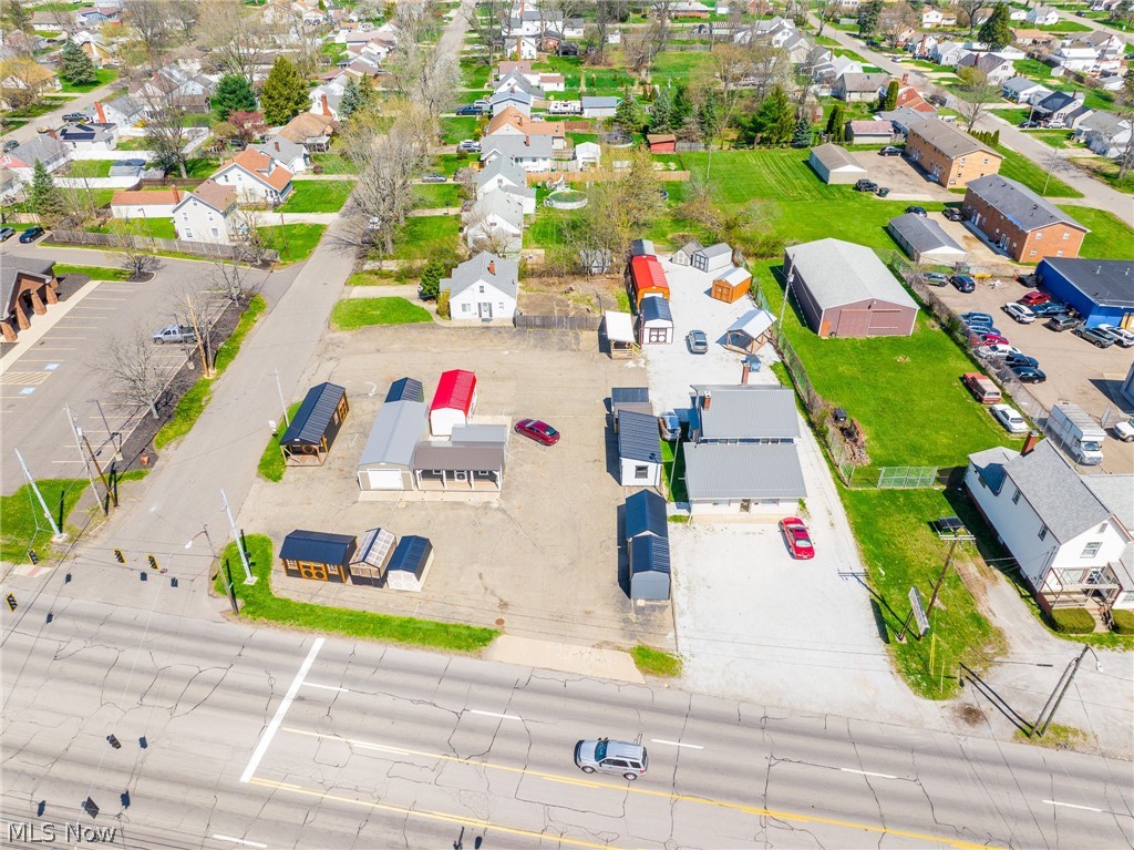 New to the market, this 0.73-acre corner lot offers outstanding commercial potential in a high-traffic location. The property features a large blacktop area with convenient access from two streets, along with a beautiful, flat layout ideal for a variety of business uses. A spacious 2,500+ square foot two-story building currently operates as a retail store, providing immediate opportunities to grow an existing business or reimagine the space to suit your vision.