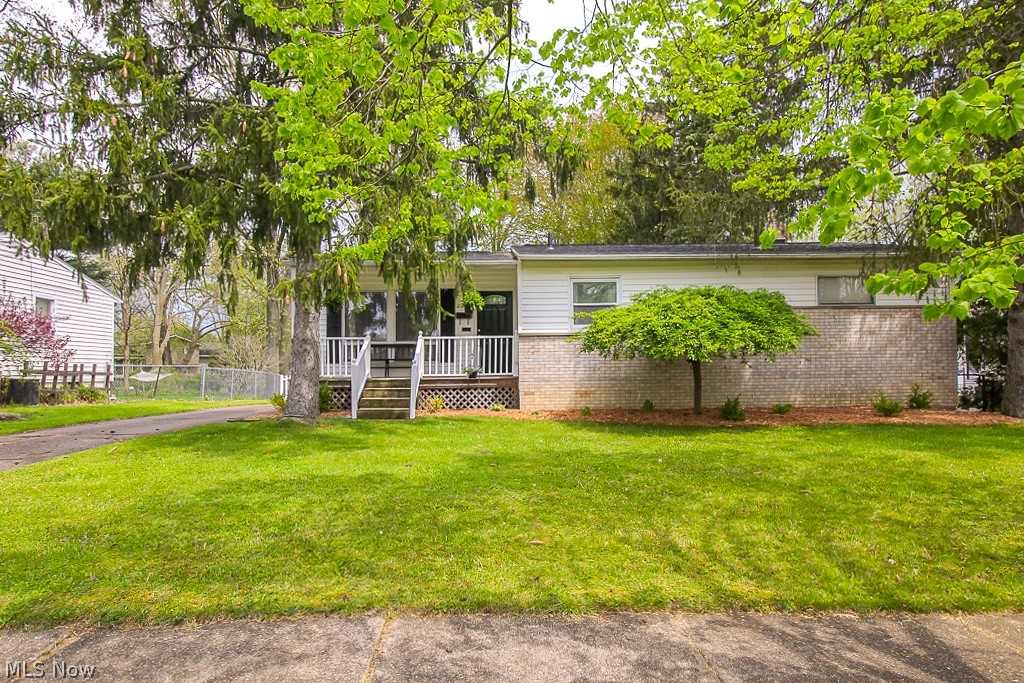 This is the home you've been waiting for!  This entire home has been renovated with the most beautiful updates.  Enter through the front door to a spacious, open concept living room, kitchen, and dining area.  The living room has vaulted ceilings, tons of open space, and an abundance of natural light beaming in from the large window and sky lights.  The kitchen features granite and beautiful cabinetry, newer stainless steel appliances, and updated flooring.  On the first floor there is a large master bedroom with a walk-in closet and master en-suite.  The updated half bath is convenient for guests, and separates the master from the second bedroom, which features beautiful original hardwood floors.  The full finished basement is the perfect space to use as a second living area, with a built in bar, ideal for relaxing or entertaining.  This level features a second full bathroom, laundry room, and third bedroom.  The outside of the home is just as beautiful and relaxing as the inside, wit