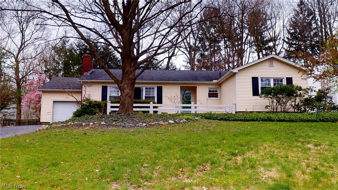 This home is waiting for it's new owners! A short walk to the University and downtown Kent! Charmingly situated, this four-bedroom ranch has hardwood floors and crown molding throughout the main floor. Champion insulated windows let in the sunlight and views of mature trees from the front yard and private back yard. Stand on the slate floor of the entryway to see the living room with its 12’ thermal picture window and gas fireplace. The eat-in kitchen with marble counter tops, custom hardwood glass-front cabinets and a built-in desk is adjacent to the entryway. Den has quarry-tile floor, solid wood built-in bookcases and cabinets with an ergonomic slide-out computer shelf, two walls of Pella floor-to-ceiling windows and an over-sized sliding glass door that leads to the patio w/gas grill hook up available and a tree-lined backyard. Downstairs, enjoy a finished family room plumbed for a wet bar but also a cozy, bright, sound-insulated home office with custom shelves and desk, a laundry