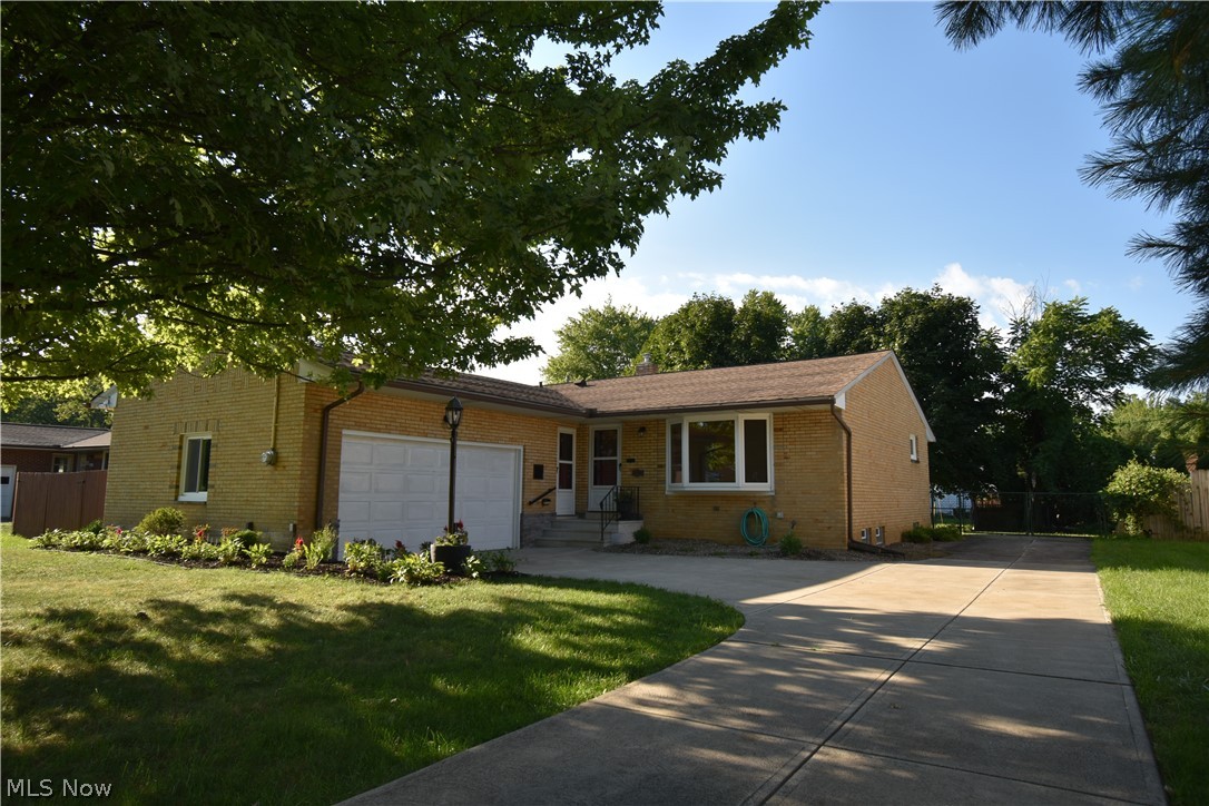 * Brick L-Shaped Ranch * Freshly Painted and Meticulously Maintained * Updated Kitchen with Rich Granite Counter tops Opening to Gleaming Hardwood Floors in Living Room with Bay Window * Stainless Steel Kitchen Appliances including Refrigerator, Stove and Dishwasher * Loads of Kitchen Cabinets Including Pantry * Additional Large Counter top for Entertaining with Additional Storage and Seating * Bright Kitchen with Doors Leading to Low-Maintenance 27 x 12 Trek Deck * Full Basement with Separate Rec Room, Laundry Room and Bonus Room Perfect for an Additional Office or Game Room * 2 Car Attached Garage * Additional Parking Pad of 25 feet for Extra Parking, Boat or RV * Dimensional Shingle Roof * One Year Home Warranty *