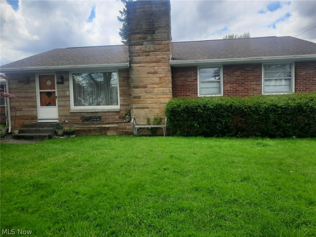 Conveniently located Brick Ranch with large back yard with cement patio.  Extremely close proximity to AU.  Gleaming original hardwood floors throughout the main floor in very good condition.  Living Room with Wood Burning Fireplace.  Two good sized bedrooms and a full bath with a walk-in shower (remodeled).  There is a 3rd bedroom/dining room/office off of the kitchen, use it for whatever you need.  There are a rec/family room and a kitchenette in the basement.  As well, there is a walk-in shower, commode and sink in the laundry area.  New furnace and central air.  The property is very well maintained.  The kitchen refrigerator, washer and dryer, basement kitchenette range, freezer and wine fridge are negotiable.