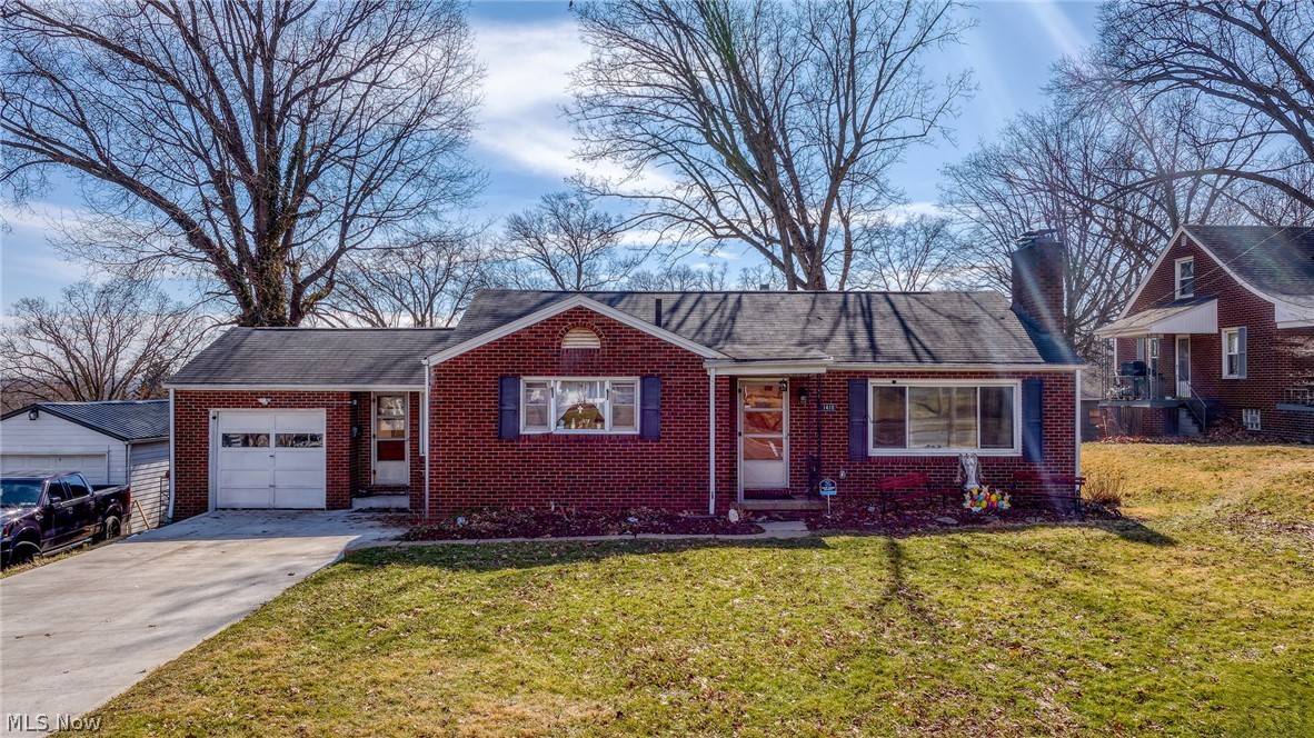 Welcome to 1410 Colonial Blvd NE, a charming brick ranch nestled in the desirable Colonial Heights neighborhood of Canton. Situated on nearly a quarter-acre lot, this well-maintained home offers comfortable one-floor living with flexible additional space.

The main level features two spacious bedrooms and a bright living room anchored by a cozy wood-burning fireplace and large picture window that fills the space with natural light. The exceptionally spacious eat-in kitchen offers abundant cabinet and counter space along with newer appliances, making it ideal for everyday living and entertaining.

A one-car attached garage connects through a convenient breezeway that leads to the private, fully fenced backyard and covered concrete patio — perfect for relaxing or hosting outdoor gatherings.

The full basement expands the living space with a partially finished area featuring a second wood-burning fireplace, ideal for a rec room, additional living area, or potential third bedroom. A full bathroom in the basement adds extra functionality and convenience.
Major updates provide peace of mind, including new furnace, central A/C, and hot water tank (2025) and a new concrete driveway (2024).

This solid brick ranch combines charm, space, and important mechanical updates in a convenient Canton location close to shopping, dining, and everyday amenities.