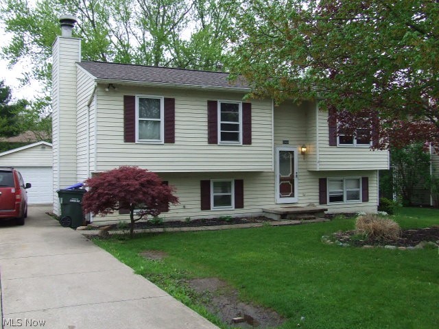 Move-in ready Bi-Level home offers many extras!   On the main level a formal living room nestles at the top of the stairs.  The eat-in, applianced kitchen is open to the living area and features French doors onto a large deck, perfect for a BBQ or just to sit and watch the stream. A large master bedroom has two full closets and plenty of space.  The 3rd bedroom is large enough for two!  You will find a finished lower level with a large cozy family room highlighted by a beautiful fireplace.  Also on this level is a bedroom, half bath, utility/laundry room and bonus area finished with built-ins that could be used as an office, workshop or craft room.  In addition, there is a fenced back yard that overlooks a lovely stream flowing along the back property line.  Two car detached garage with opener and electric.  There is a baseball field at the end of the street, and also close to shopping, schools, parks and expressway.  Make this Cuyahoga Falls home yours! Call for a private showing toda