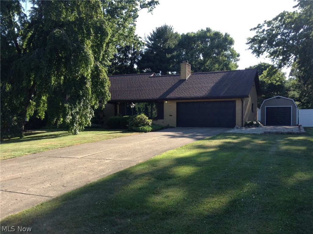 This 3 bedroom 2 bath home is located in a desirable neighborhood across from the College of Wooster.  The original owner loved to entertain as you will find with the size of the rooms. The fireplace in the living room is gas and the lower family room has a wood burning fireplace.  You will find cedar closets in the hallway along with the original chandelier lights in the upstairs bath.  The beautiful 15 x 20 screened in patio off of the family room gives you a wonderful view of the nicely landscaped fenced in back yard.  There is a small garage that was added in 2013 that has electric.  Shingles are 4 years old, furnace is 5 years old and all appliances are less than 3 years old.  The house had new carpet installed in 2014.