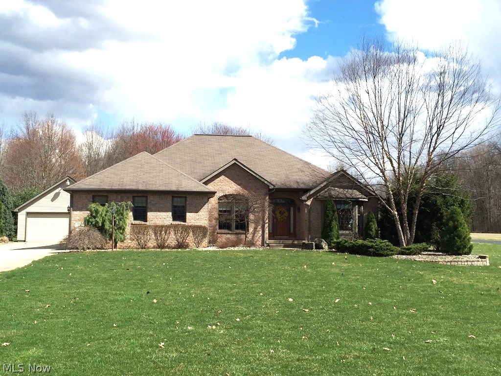 What an Awesome Custom Ranch on almost 1 Acre!   Nice open floor plan, Great room has 10' ceilings and a Gas Fireplace, Private Master Suite separate side of house with huge Bath and Walk-in Closet. Lovely Office with Bay Window, Formal Dining room, Kitchen with all Appliances, Pantry, and Eating Area leads out to an all year around Sun Room with Vaulted Ceilings,  a Black Wrought Iron and Aluminum Fence encloses the Yard and Brick Patio. There is a 2 Car Attached Garage PLUS a 1750 square foot Heated Detached Garage w/attached dog kennel.  Awesome Home !!!