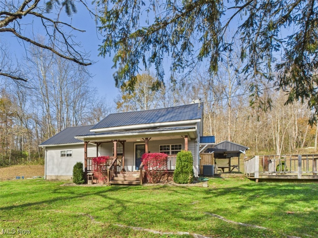 Tucked away on 2.67 acres in the desirable Warren Local School District, this well-maintained 3-bedroom, 1-bath home offers the perfect blend of country privacy and modern updates. Step inside to find new flooring throughout, a beautifully updated bathroom and laundry room, and spacious rooms filled with natural light.

The kitchen features plenty of gorgeous wood cabinetry, newer appliances, and opens to a cozy living area highlighted by a stone fireplace—perfect for relaxing evenings at home. Major updates over the last decade include heating and central air, windows, 200-amp electric service, and new exterior doors, giving you peace of mind for years to come.

Enjoy outdoor living at its best with a covered front porch and a large brick patio complete with a ceiling fan, hanging table, and surround sound—ideal for entertaining or quiet mornings with coffee. The 24x24 detached garage offers water, great storage, and workspace potential. With mature trees, open yard space, and room to roam, this property combines comfort, functionality, and outdoor enjoyment in one beautiful setting.

Come experience country living just minutes from town—your next home is waiting!