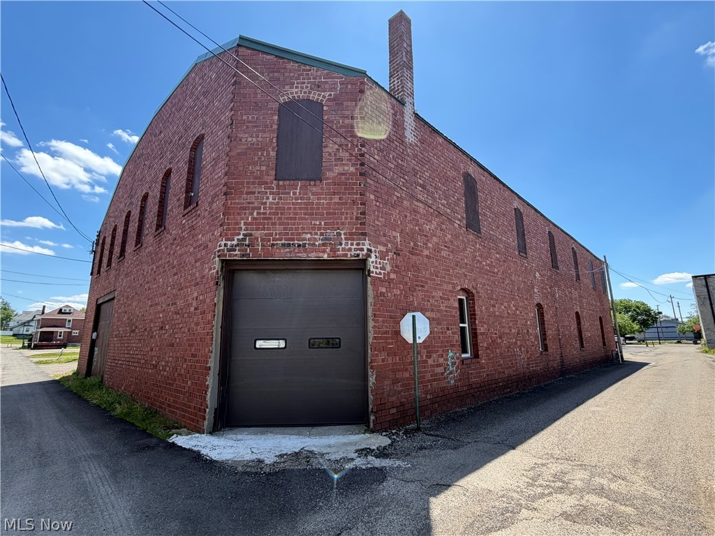 Warehouse / Manufacturing building available with many updates Located on Main Street in Coshocton with nice parking lot for customer parking or room to expand, So many possibilities with this property, Downstairs has been updated with 2 new Hvac systems heating and air. Cargo lift has been updated to upstairs adding lots of storage room, newer metal roof, 3 Phase Electric. Looking for business opportunity in an area that is growing do not miss this opportunity. Seller will consider seller financing or Lease as well .