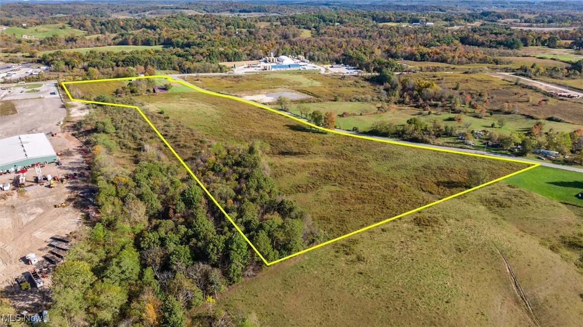 Discover a rare opportunity to develop over 18 acres of commercial land in a high-visibility, rapidly growing corridor. Ideally located just minutes from Interstate 70 and 6 miles from Interstate 77, this property offers exceptional connectivity and access—positioning your business or development project for success. With full road frontage this property offers excellent visibility and accessibility for a wide range of commercial uses. The land is ready for development, with utilities available to include 3 phase electric service. This property provides regional access to multiple major markets, making it ideal for retail, industrial, logistics, healthcare, or mixed-use development with a strategic location of 35 miles to Wheeling WV, one hour to major cities such as Columbus, Canton and Marietta. This is a prime opportunity for developers and investors to secure a well-positioned property with significant upside potential.