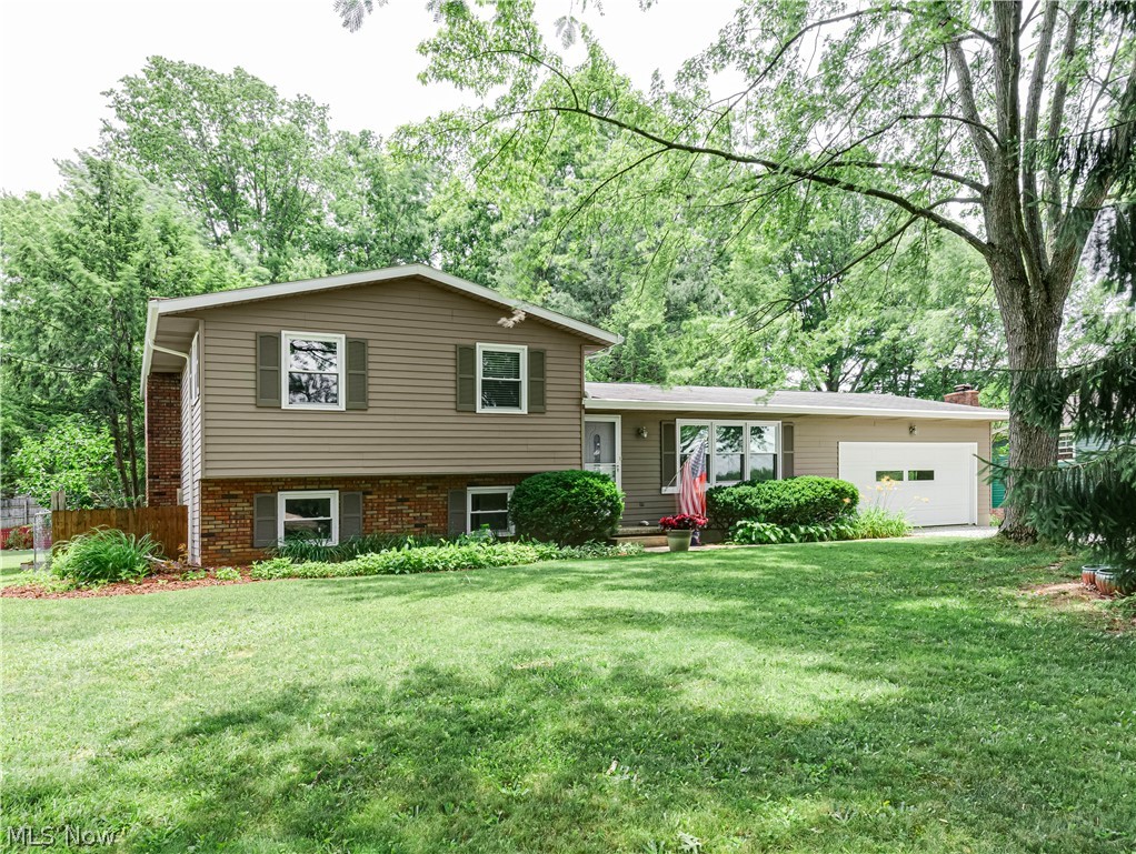Welcome to this beautiful split-level home in Doylestown, offering 3 bedrooms, 2 full bathrooms, and 1,639 sq. ft. of living space. This well-maintained home features a functional layout with spacious living areas, comfortable bedrooms, and plenty of room to relax or entertain. Step inside and be greeted by a spacious living room filled with natural light. The living room flows seamlessly into the brand-new eat-in kitchen, featuring updated cabinetry, granite countertops, and a dining area. Just off the kitchen, sliding glass doors lead to the back deck overlooking the backyard, complete with a fire pit and storage shed. Upstairs, you'll find three bedrooms, including a spacious primary bedroom with direct access to the shared full bathroom. Downstairs, you'll find a cozy family room centered around a beautiful brick fireplace. Just around the corner is a home office, along with a full bathroom that completes this level. Below the family room, the basement features a laundry and utility room with ample storage space. An additional room with built-in shelving provides even more storage options. Additional features include a 2-car attached garage. Updates include new windows and a brand-new sliding glass door (2025), painted siding and new garage door openers (2025), fully updated primary bathroom (approx. 5 years ago), well pump line (2020), and A/C (2017). Conveniently located just minutes from Route 21 access. Don't miss the opportunity to make this beautiful home yours today!