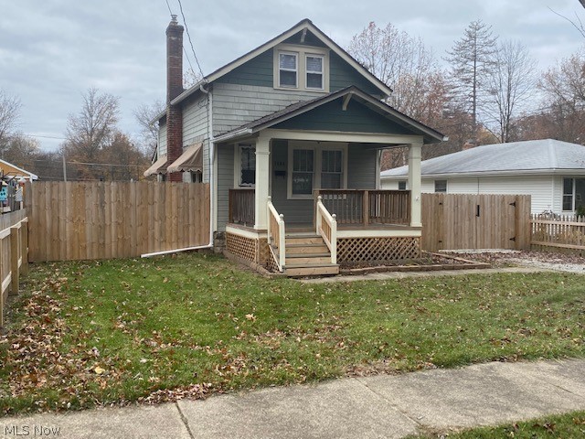 This seller has done it ALL for you!!  Just move in before the holidays and enjoy this adorable bungalow in the heart of Stow!!  Curb appeal galore with well maintained and freshly painted cedar shingle exterior plus a newly built front porch to enjoy!  You'll enter through the front door to the cozy living room with brand new laminate flooring!  A dining room perfect for seating 2-4 comfortably plus the owner added a breakfast bar, that you can use if you wish!  Completely updated first floor spacious bathroom!  The kitchen is updated featuring a farmhouse sink, oil rubbed bronze fixtures, brand new two tone cabinets, stainless steel oven and refrigerator and a new countertop!  Upstairs you'll find two large bedrooms with brand new gray carpet!  The backyard is a nice size and completely fenced in PLUS there's a two car detached garage!  Fencing gate goes across driveway for added privacy, too!  Other major updates include:  roof, furnace, hot water tank (2011); bath/kitchen/lvg/dinin