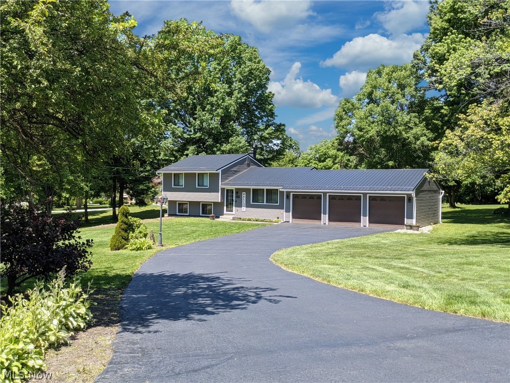 FEEL LIKE YOU ARE ACTUALLY INSIDE THIS HOME! WALKTHROUGH THE 3D VIRTUAL TOUR OF THIS PROPERTY BY CLICKING THE LINK! Move right in to this 3 bedroom 4 level split home located in Hubbard! The main floor features a large living room, dining room, and kitchen with granite countertops with cabinets all with pull-out drawers for shelving. The upper level features 3 bedrooms and a full bathroom. The lower level features another huge family room, a half bath, and a full bath. The basement features an additional living area and your laundry area. The exterior has a 3 car attached garage, a large front and back yard all nestled on a nice sized corner lot! Updates to include 2021 drop ceiling in the basement and seal coated driveway. 2020 New carpet in the family room and basement. 2019 Lifetime warranted metal roof, vinyl siding, front door, security door, dishwasher, AC unit, water heater, finished basement, and outdoor light fixtures. 2018 Electric panel, waterproofed basement, washer, dryer,