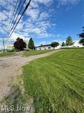 Endless possibilities.  Very high traffic location near busy Airport Rd and Rt 40 intersection at the Airport Rd Exit (I70).  This property has so much potential for commercial expansion.  Formally used as a motel and antique shop, it has over 6,000 sq ft.  All public utilities.  Hotels, restaurants, gas stations, industrial parks etc, all very close making this a prime location for development.  New roof in 2023.  Some new windows.  Any mineral rights that seller owns will transfer.  Almost 300' of road frontage on RT. 40.  Currently has a billboard that earns $125 per month.