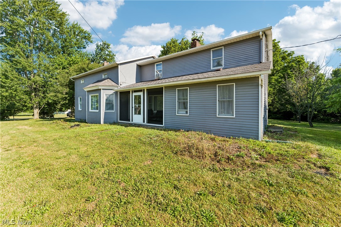 Welcome to this charming 4-bedroom, 3-bath farmhouse nestled on nearly 5 picturesque acres in desirable York Township within the Buckeye Local School District. Built in 1875, this spacious 2,720 sq. ft. home beautifully combines historic character with modern updates and offers a flexible floor plan to fit today's lifestyle. The updated eat-in kitchen features white soft-close cabinetry, Granite countertops, stainless steel appliances, and plenty of workspace. A formal dining room opens to the inviting great room with a large bay window overlooking the scenic property. The main level also includes a first-floor office with built-in shelving, a convenient laundry room, and a private owner's suite with a walk-in closet and updated bath featuring a tiled walk-in shower. Upstairs, you'll find a second owner's suite with a spacious walk-in closet and beautifully updated bath with double vanity and tiled shower, along with two additional bedrooms and a large family room, offering excellent space for family, guests, or multi-generational living. The basement showcases original hand-hewn beams from the home's 1875 construction and provides ample storage, workshop, or canning space. Outside, enjoy nearly 5 acres with mature landscaping, fruit trees, raspberry and elderberry bushes, and plenty of room for gardening, recreation, or future outbuildings. A newly added deck is perfect for relaxing or entertaining while taking in the peaceful country setting. The screened front porch and cedar split-rail fenced area add even more charm. Conveniently located just minutes from Medina's Historic Square, shopping, dining, and major highways, this one-of-a-kind property offers the best of country living with everyday convenience. Boiler heat. No central air. Some flooring updates may be desired, providing an opportunity to add your own personal style and finishing touches to this beautiful country home.
