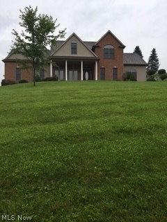 ALOT OF SQUARE FOOTAGE FOR ONLY $215,000   Great view, 4 bedrooms, 3 1/2 bath, Jack and Jill bath,  3 car attached garage that is insulated and dry wall finished to code, new garage door and opener,  formal dining room, large eat in kitchen, great room with 21' ceiling, large windows with natural light.  Dual climate with 2 furnaces and central air.  Master suite with his and hers walk in closets.  City water and sewer, 2x6 exterior walls, 13 course basement, architectural touches.  Fresh paint, new carpet, new floating floor in foyer and kitchen.  Granite countertop, plumbing in basement for bathroom. Finish the basement for additional family room.   2,532 above ground square footage finished living space. This is a beautiful home in MOVE-IN CONDITION. Make an offer today