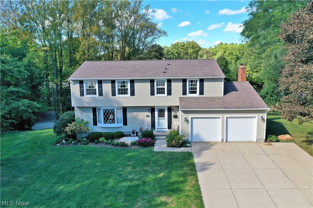 Fantastic 4 bedroom, 2 1/2 bath colonial is so well maintained, quality, super clean, warm and inviting.  Enter the home and enjoy the nice living room with bay window and dining room combination.  Beautiful eat in kitchen features plenty of custom made Schrock cabinets,  granite counters, nice appliances, superb view from the kitchen window and slider to the deck AND is open to the family room, which features a gas fireplace to keep you warm this Fall and winter.  There is also a french door to the deck.  A powder room completes the first floor.  The second floor features  the primary ensuite with full bath/walk-in shower and large walk in closet.  The other 3 bedrooms are a great size and offer good closet space.  An updated full bath is a bonus.  Solid wood 6 panel doors throughout. The outdoor space is so lovely featuring a 2 tier deck - perfect for entertaining, power awning to shade you on those hot, sunny days and beautiful brick patio with a firepit and seating wall to enjoy th