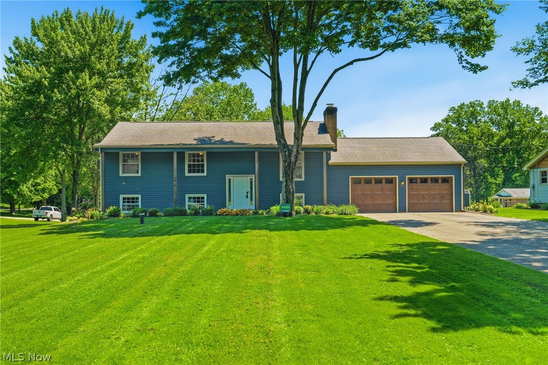 This is a showstopper and the one you've been waiting for.  Discover the perfect blend of comfort, space, and modern updates in this charming bi-level home set on just over an acre of beautifully flat land. Step inside to an inviting open-concept living area featuring a stunning quartz kitchen, center island, and a gas fireplace that sets the tone for cozy winter evenings. From the dining area, sliding doors open to a screened-in sun porch, where you can relax and take in the country air and feeling.
The main level offers three well-sized bedrooms and a full bath, all freshly updated and move-in ready. Downstairs, the possibilities expand with the option for large master suite, an additional bedroom or bonus room, a second full bath, and a spacious family room complete with a kitchenette/wet bar—ideal for guests, extended family, or an in-law setup.
An oversized two-car garage, a welcoming front porch with pillars, and a deck for outdoor enjoyment add to the home’s appeal. Nearly everything has been updated: kitchen, baths, flooring, paint, windows, siding, gutters, doors, fixtures, lighting, and more. Laundry hookups are available on both levels for added convenience.
A peaceful country setting, modern upgrades, and flexible living spaces make this home truly special. Schedule your private tour today.