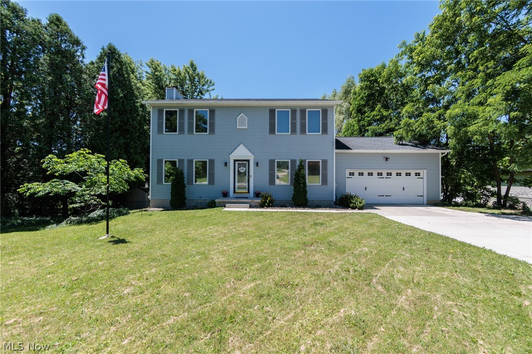 An exceptional Tallmadge colonial on almost an acre of land.  This 3 bedroom 2.5 bath home features very large bedrooms, with a master suite with a walk-in closet, and additional closet.  A large great room has a lovely fireplace.  The whole home has natural hardwood floors.  The open concept has a large eat-in kitchen, and formal dining.  A private rear yard is completely fenced, and has a composite deck, swing set, a zip line, and shed.  There is a full WALK OUT basement with an office and a few month old hot water tank, an attached 2 car garage, additional parking, and so much more.