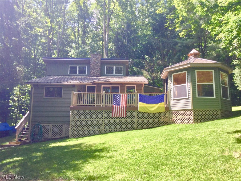 This well maintained and remodeled cabin,is a great get-away on beautiful Piedmont Lake. (Lot#P-320) With a lake view, it offers a front deck with and extended enclosed gazebo room attached; use it for relaxing on cool days or evan a kid's camp-out. This 1.5 story, 2 bed and 1 bath cabin is approx. 1230sf with lots of possibilities.  It has a modest size living space with pellet stove firebox and a beautiful stone chimney leads the eyes to the loft, spacious enough for 2 queen beds by way of spiral staircase. Sunken kitchen, jack and jill bath, large main floor master, office and laundry space.  Stove and refrigerator included.  Other info: Steel roof - single shed - circle gravel drive - well water - electric utilities - private dock.