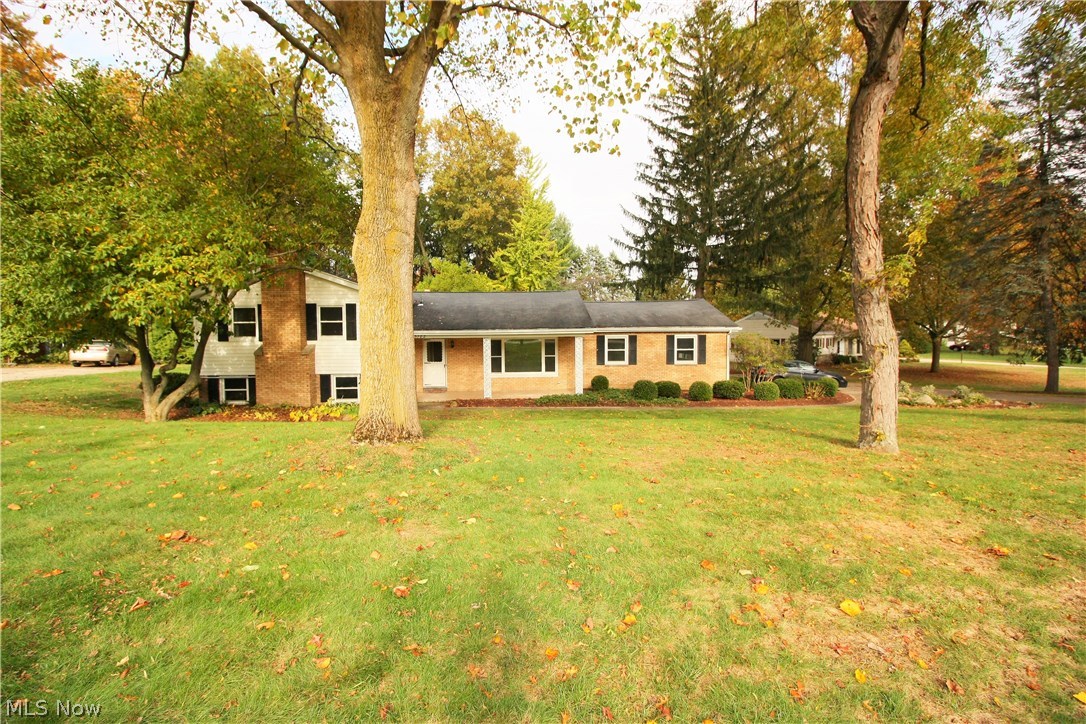 Welcome home to this spacious 4 bedroom split level. Enjoy gorgeous view of the woods from the sunroom. Perfect for entertaining you have 2 family rooms, one on the first level and the other in the lower level with a fireplace.  You can pull into the 2 car garage this winter and enter the home out of the snow. The home is move in ready. Enjoy this home the day you close. The location is in the heart of Kent. Easy access to the KSU, Dix stadium, 261, Summit road, 59 and 43. Take 261 to 43, Tallmadge or Cuyahoga falls. Take 59 into Kent or to Stow. Grab summit to 43 or to 44 and get on route 76. The lower level has a room that is currently used as an office, but can be converted to another bedroom. Don’t miss this one…quiet location, large wooded lot and quick access to everything. Call today for a private showing