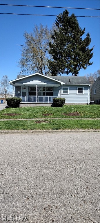You'll want to be the first to view this home that has great curb appeal! The large covered porch is great for relaxing with family and friends on a warm summer day.  The kitchen has been updated with all new Cabinets, Counter Tops and Armstrong Terraza Grand Flooring. New tile backsplash gives the kitchen a clean crisp look. All appliances stay too. Range, Refrigerator, Washer & Dryer.
  There are original hardwood floors through the entire first floor. All rooms have been freshly painted and there is built in shelving in the living room and a 3rd bedroom could easily be used as a dining area as it has a built in china cabinet. The Furnace, A/C, and Hot Water Tank are only a few years old. All of the blinds throughout the home including the large picture window will stay with the house.  The full bathroom has been updated with new flooring new bathroom cabinet and toilet. There is also a built in shower in the tub.  There is an enclosed back room off the back of the home perfect for