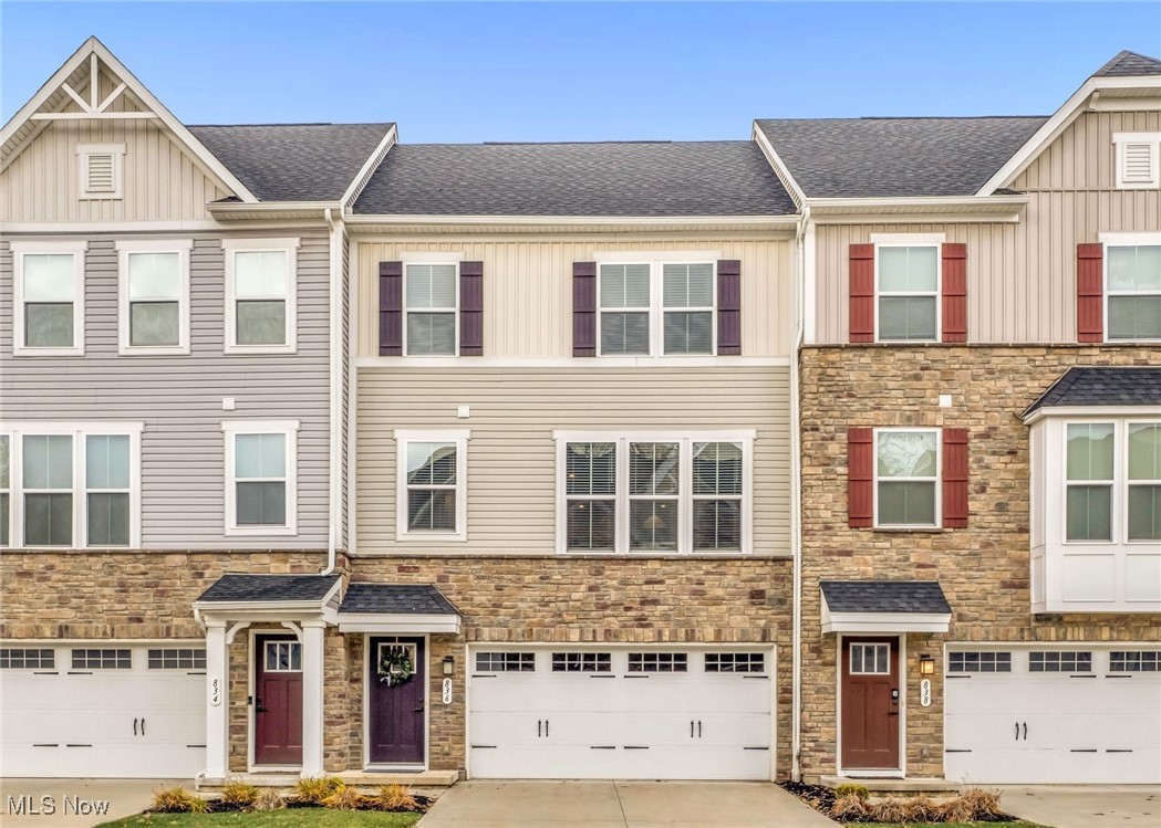 Stylish, immaculate, move-in ready townhome with NO PROPERTY TAXES on the structure until tax year 2035! Prime location convenient to parks, schools, shopping and The University of Akron. This bright and inviting home in the sought after Hickory neighborhood features 10-foot ceilings and oversized windows that fill the open floor plan with natural light. The crisp white Kitchen shines with stainless steel appliances, sleek quartz countertops, and $15,000 in tasteful builder upgrades. Luxury vinyl plank flooring extends throughout the Main Level, which also includes a convenient Half Bath and perfect nook for your home office. Upstairs, the spacious Primary Suite boasts a large Walk-In Closet and beautifully upgraded Bath with dual sinks and premium finishes. Two additional Bedrooms and another upgraded Full Bath complete the Second Floor. The Walk-Out Lower Level provides great flex space for your treadmill or future rec area, and opens to a yard ready for your personal touches. You could add a patio or fenced-in space for your pup! Enjoy a nearly new home with all the upgrades and no property taxes on the building until tax year 2035. The lot is still fully taxed (1st half 2025 was $444.07). Monthly utilities for 2025 were $27-$50 Electric; $40- $55 Water & Sewer; $50 for Gas in Summer, $90 in Winter. Schedule your private showing today!