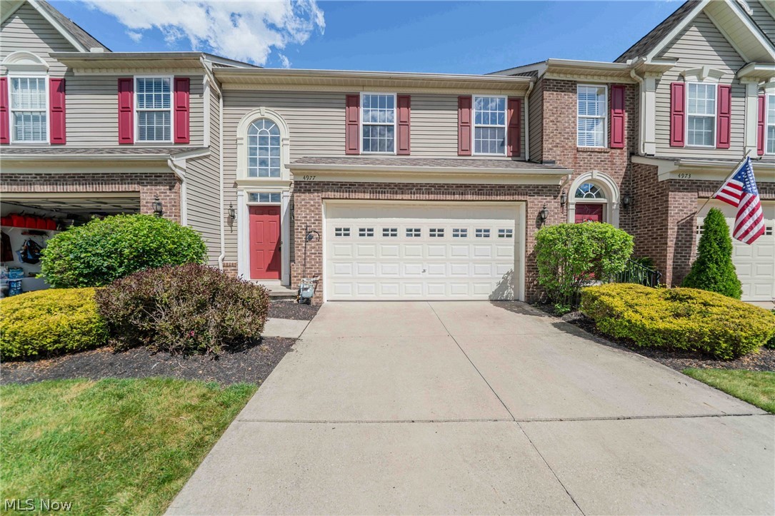 Welcome to this beautifully well-maintained townhome in the highly desirable Hidden Lakes community, offering the perfect blend of comfort, style, and low-maintenance living. Located within the award-winning Hudson School District and conveniently close to shopping, dining, and major highways, this home is ready for its next chapter.

Step inside and be greeted by soaring ceilings and an abundance of natural light that create an open, airy atmosphere throughout the main living area. The spacious great room is anchored by a large window and flows seamlessly into the kitchen featuring granite countertops, a center island, and generous cabinet space, making it ideal for both everyday living and entertaining.

The sought-after FIRST-FLOOR OWNER'S SUITE offers convenience and privacy, complete with a spacious bathroom and ample closet space. Upstairs, additional 2 bedrooms provides flexibility for family, guests, or a home office.

There are 2 laundry hook-ups: one on the 2nd floor and one in the basement.

The finished lower level expands the home's living area with plenty of room for recreation, media, fitness, or gatherings. Outside, relax on the patio and enjoy peaceful views of the surrounding greenery, a serene setting that makes coming home feel like a retreat.

With its impressive ceiling heights, thoughtful layout, and prime location in one of Peninsula's most desirable communities, this is a wonderful opportunity to enjoy easy living in a beautiful setting.
