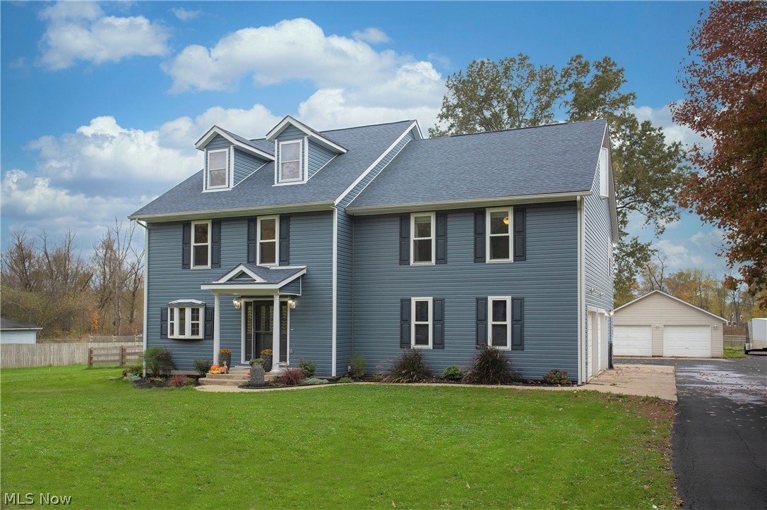 If you're looking for a lot of space and a big beautiful lot, this is it! This custom built 3 story colonial has tons of space to roam! Walk into the welcoming marble tile foyer that opens to the large living room and formal dining room. The spacious eat in kitchen has solid wood, high quality cabinetry with rich crown moldings and stainless appliances. The luxury vinyl planked flooring is waterproof and brightens the space! The cathedral 3 season sunroom overlooks the gorgeous 1.5 acre lot. The 2nd floor includes a large master bedroom suite with a master bath and walk in closet plus 3 additional bedrooms PLUS a 2nd floor office! The FINISHED 3RD LEVEL offers a media family room, a 3rd full bath and an additional bonus room!!! Exterior composite decking has built in seating to enjoy an evening bonfire. Two car attached garage PLUS a 24x30 detached garage. The concrete finished crawl space is under the entire first floor and is 4 feet in height, easily accessible thru a walk down from