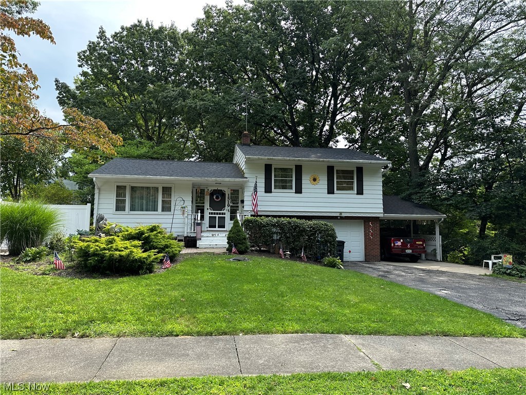 Lots of potential in this spacious split level in the heart of Kent! Age and health has left a seller that has not been able to keep up. Spacious living room and dining area on the first floor (look past the bed that is in those rooms). Under all of the carpet throughout most of the house are hard wood floors!  An addition off the back of the house is roughly 10 years old, and provides another fabulous space that looks out over the tranquil wooded back yard. Upstairs has the 3 bedrooms and the full bathroom. As you leave the kitchen, and go down a few steps, you enter the heated/AC garage and laundry room, along with a half bath.  (Imagine this.....What a fabulous opportunity to finish that space into a massive living space!)  Current seller doesn't use it as a garage, as she uses the attached carport instead. From that garage area, go down another level to a finished recreation room that is roughly 24x13.  There are two patios that are perfect for gatherings or just to enjoy outside l