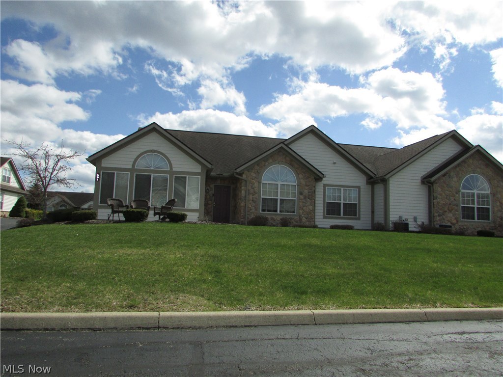 A remarkable 3 bed, 2 bath ranch condo at The Crossings At Northwest in Tallmadge.  This spotless unit is almost 1800 square feet of living space.  The open great room is very large, and features a fireplace.  The great room opens to a large sun room, dining area, and kitchen.  The kitchen has ample cabinets and counter top space.  The master suite has vaulted ceilings, double sinks, and a huge walk in closet.  The 3rd bedroom is also an office option.  There is a 2 car attached garage, first floor laundry, and so much more.  Enjoy the pool, exercise room, and common rec center that can be reserved for family functions, receptions, etc.