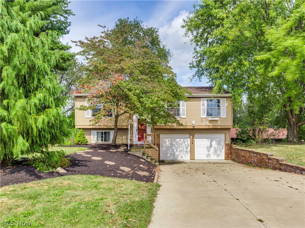 This picture perfect home features so many updates and a bright, open floor plan. Beautiful living room, amazing kitchen/dinette with granite counters, brick accent wall and large island with eating bar, huge first floor laundry adjacent to the kitchen also serves as a butler pantry with lots of cabinetry and counter space too, totally remodeled full bath on first floor, three bedrooms including and an awesome owners suite with two closets and a remodeled 12 x 13 full bath with whirlpool tub, separate showing and beautiful vanity. WOW! The lower level is complete with a family room and a third full bath. Gorgeous wide plank wood flooring, new roof (2009), new well pump, pressure tank, water softener and iron filter (2009), rec room and lower level full bath remodeled (2016), new deck (2016), updated lighting and electric throughout (2010), new concrete driveway (2013), new furnace, central air conditioning and water heater (2010). Huge two car attached garage plus a additional 12 x 26