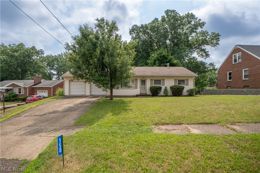 This charming 3-bedroom ranch offers comfortable one-floor living, hardwood floors, and a spacious backyard in a convenient Perry Township location. A large front picture window fills the living room with natural light, while recessed lighting and warm hardwood flooring create an inviting place to relax or gather. The open flow continues into the dining area, providing an easy setting for everyday meals and entertaining.

The adjoining kitchen features wood cabinetry, black stainless steel appliances, and a double oven, blending practical workspace with a clean, updated look. Down the hallway, a linen closet adds convenient storage, and all three bedrooms feature hardwood floors and natural light. The updated full bathroom includes LVT flooring, built-in storage, a laundry chute, and a tub/shower combination with a tiled surround.

At the rear of the home, a generous enclosed three-season room overlooks the fully fenced backyard and creates a wonderful extension of the living space for relaxing, dining, or entertaining throughout much of the year. The unfinished lower level offers abundant storage, a workshop area, washer and dryer, reverse-osmosis system, newer water softener, and a toilet, providing useful space with future possibilities.

Outside, the .35-acre property features a privacy-fenced backyard with room for outdoor activities, gardening, or pets. A detached 2-car garage with newer garage door openers completes the property. Additional highlights include central air and a new furnace installed in 2026. With its easy single-level layout, hardwood floors, enclosed porch, and practical updates, this inviting ranch is ready to be enjoyed!