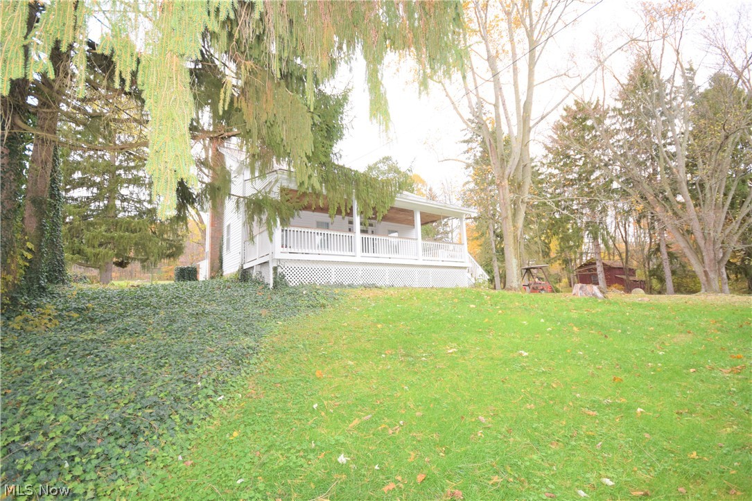 Three bedroom, 1 bathroom Century home sitting on a 3.6-acre lot in Doylestown. This private home is located in a country setting, surrounded by trees and farms. You will love the large, covered front porch -- it's the perfect spot to sit and overlook the peaceful, beautifully landscaped property. The house has new flooring and carpet (hardwood under carpet). Spacious eat-in kitchen, living room, and a bonus family room. Along with the detached 3-car garage, there are 3 extra sheds offering you even more storage space. This house also has a slate roof -- which are known to be beautiful, durable, fire resistant,  and environmentally friendly. You will be impressed by this charming country home!