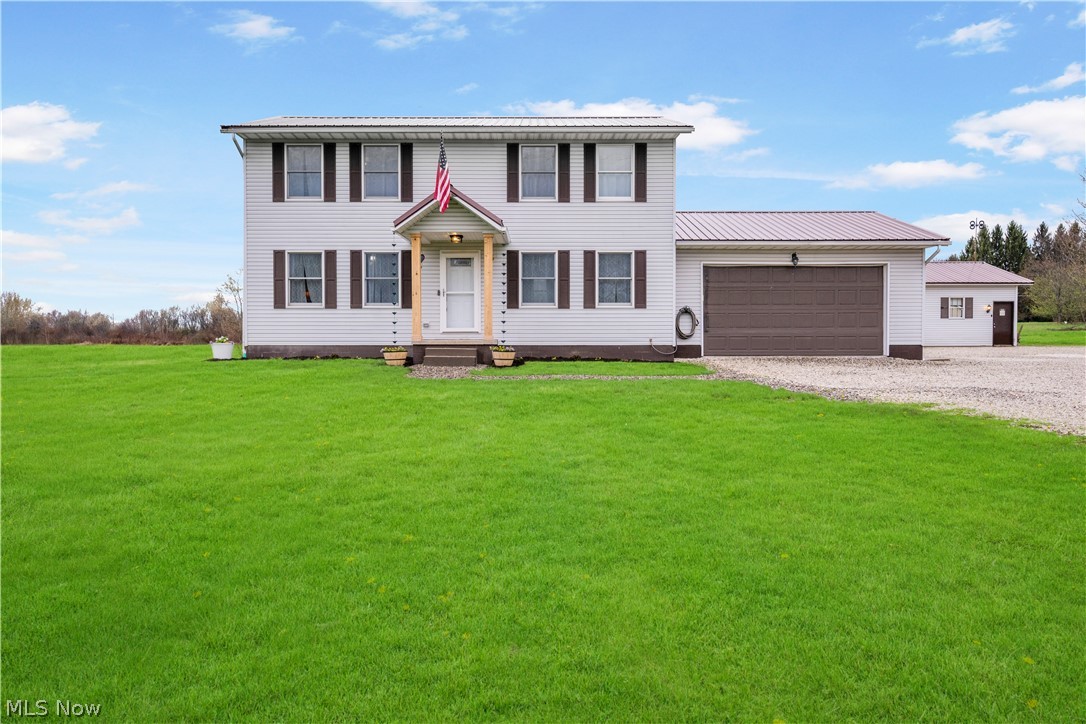 This is the one you’ve been waiting for! This beautiful 3-bedroom, 2.5-bath colonial sits on over 1.5 acres and offers the space, updates, and outbuilding everyone is looking for. The charming front porch, that was recently resurfaced & has new porch columns, & new front door (2025) that adds curb appeal.

Inside, you are welcomed to fresh neutral paint, new baseboards, and LVT flooring throughout all in 2024 giving the space a clean, modern feel. The layout is spacious and functional, with the family room conveniently located just off the kitchen so you can stay connected while cooking or spending time with family & pets. The eat-in kitchen truly serves as the heart of the home, offering space to gather around the breakfast bar or dining area. A half bath is conveniently located just off the kitchen, along with an additional flex room currently used as a home office or homeschool space.

Upstairs, you’ll find 3 generously sized bedrooms. The primary suite features a private ensuite bathroom and a large walk-in closet with new closet organizers. All bedrooms include updated closet systems for added storage and organization.

The basement includes a new waterproofing system installed by Ohio Basement Authority(2025), providing peace of mind for years to come. Additional updates tankless hot water heater (2024), new kitchen appliances (2024), washer & dryer (2024), & reverse osmosis system with water softener & UV filtration (2024).

Car enthusiasts, hobbyists, or anyone needing extra space will love the oversized heated 2-car attached garage and the impressive 24x32 detached outbuilding. The heated outbuilding has, insulated walls, 220 electric service, wired internet connection. Both the home and outbuilding had metal roofs installed in 2020.

The deck was sanded & sealed 2025, a new patio door to the deck (2025).

Enjoy the privacy & space of country living while still being within convenient distance to everyday amenities.