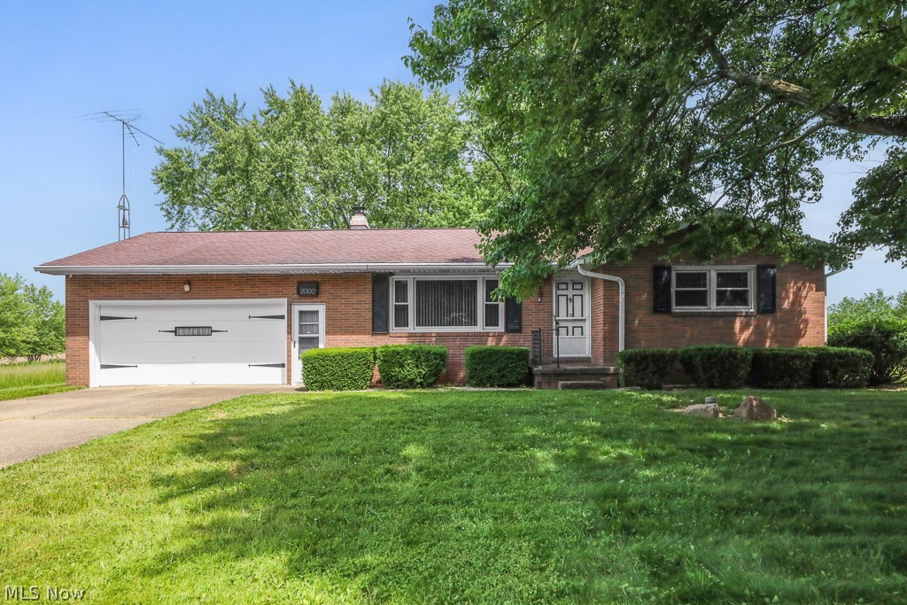 Well-maintained brick ranch on a spacious 0.84-acre lot in Washington Township, Marlington School District. This 3-bed, 2.5-bath home offers convenient one-floor living with a bright living room, functional kitchen layout, and dining area overlooking the backyard. The family room features a cozy fireplace, and the home includes a cedar closet for ideal off-season storage. Three bedrooms, including a primary with attached half bath, provide practical space and flexibility. Full basement offers storage or potential finishing options. Attached garage, central air, and electric heat. Peaceful country setting just minutes from Alliance amenities.