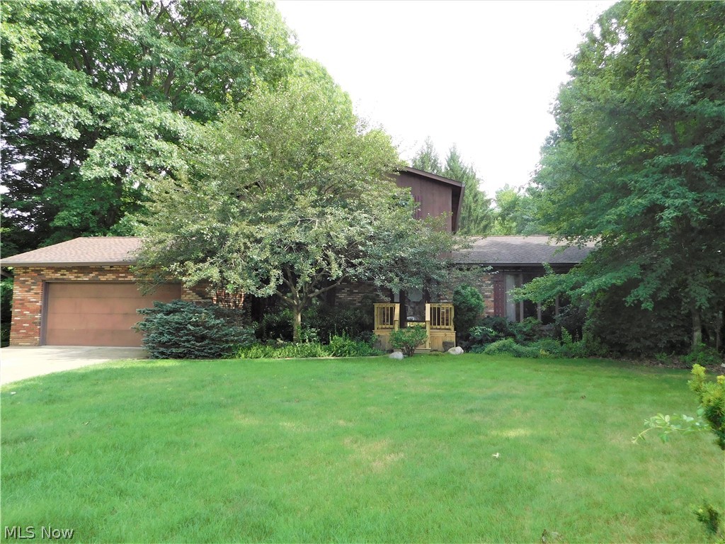 Location! Location! Location!! This home is nestled in a lovely, private wooded lot just a few minutes drive to Rt. 8, shopping, restaurants and parks!  If you aren't afraid of a little sweat equity and would prefer to put your own cosmetic twist on a home with good, updated mechanicals--then this one is for YOU!  Imagine adding luxury vinyl flooring and bright, paint throughout this spacious beauty!!  Large foyer w/winding staircase to second floor, nice sized first floor 1/2 bathroom, first floor office/play room, and the biggest living room around-perfect for entertaining!!  The dining room is enormous and flows into the eat-in kitchen!  Family room is in rear of house and features wet bar, brick fireplace and sliding door to brand new deck!  Master bedroom w/it's own bath, two other good sized bedrooms and a second full bathroom complete the upstairs.  The basement has endless possibilities--finish it as you wish PLUS it's a walk out to a great concrete patio and backyard!  Updates