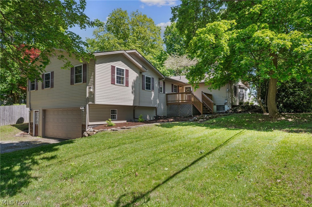 Welcome to this beautifully maintained ranch home in Concord Township, situated on a spacious half-acre + lot with a walkout basement and plenty of room for entertaining! This inviting home offers 3 bedrooms, 2.5 baths, and a large addition completed in 2008 that adds exceptional living space and functionality. The main level features beautiful hardwood flooring throughout the living areas, while the bedrooms offer durable vinyl flooring. The stunning great room showcases vaulted ceilings and a cozy fireplace, creating the prefect gathering space. A dedicated office provides flexibility and could easily serve as a fourth bedroom. Convenient main-floor laundry adds everyday ease. The kitchen features tray ceilings, a large eat-in area, and included appliances, making it both stylish and functional. Step outside to enjoy the trex deck overlooking the fenced side yard- ideal for relaxing, entertaining, or pets. The finished walkout lower level offers additional living space with nature stone flooring, while the oversized two-car garage provides ample storage. Beautifully cared for inside and out, this home combines comfort, space, and charm in a fantastic setting!