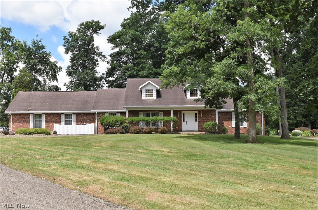 First time offered to the market! Enjoy the Country Club golf course views from the back brick patio of this story and one half home.  Very large first floor master bedroom with master bath.  First floor has big eat in kitchen with lots of counter space and cabinets.  Open Family room with gas log brick fireplace and extra large sliding glass door to take in the view.  There are three nice size guest bedrooms upstairs with oversized full bath.  The basement is huge with ample storage space and ready to be finished with full bath and brick fireplace.  Furnace and hot water tank are new. This home has a whole house generac generator.