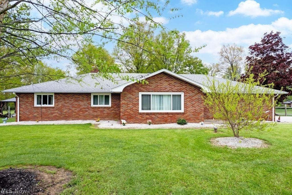 Have you been searching for easy country living? Look no further. This meticulously cared-for brick ranch sits on 1.74 pristine, picturesque acres. The rear of the fenced property backs to woods with plenty of room for kids and animals to play. Enjoy country living just minutes from town, outside city limits.
Outside are 3 outbuildings: a 6x8 chicken coop, 10x20 storage shed, and 24x32 garage with its own driveway, concrete floor, automatic opener, 12x12 entry door, and rear garage access. Perfect for an RV, tractor trailer cab, workshop, or all your toys. All outbuildings have electricity. Entertain in the 12x16 gazebo with concrete flooring and a center fire pit.
This move-in-ready brick home features many updates, a Blink security system with 5 cameras, partially finished basement with fireplace, bonus storage/pantry area, upgraded attic insulation, solar attic ventilation system, wood floors, spacious kitchen/dining area, nicely sized bedrooms, enclosed hot tub room, whole-house generator, and tankless water heater. So much to love—call today for your private tour!