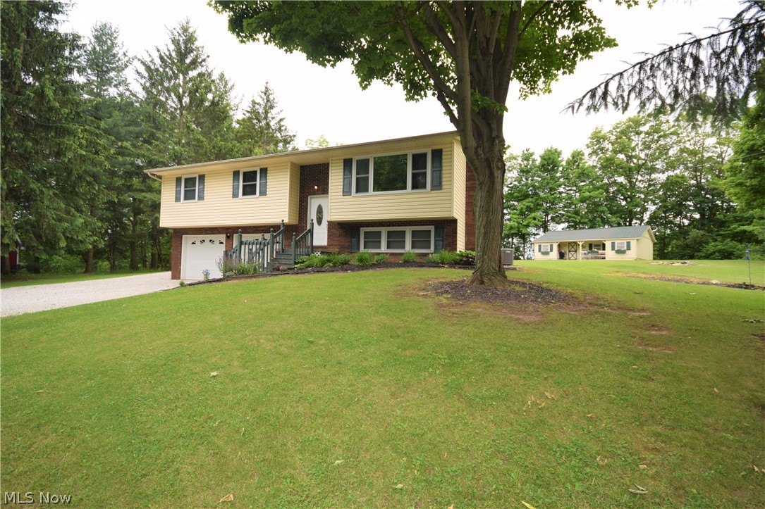 Welcome to 7696 Boneta Road in Wadsworth! You'll fall in love with this gorgeous 3 bedroom, 3 bathroom home that has numerous features throughout. Step into the kitchen and you'll immediately notice the premium kitchen flooring, stainless steel appliances, spacious counter tops & plentiful cabinets. The sliding glass doors off the dining room lead to a wooden deck overlooking the spacious backyard. The living room has a large window overlooking the front yard that allows so much bright, natural light into the home. The lower level offers MASSIVE 2 car garage with nature stone floors that enters into a mud space a bonus living room and updated full bathroom. You don't want to miss this!
Lot is actually 1.99 acres