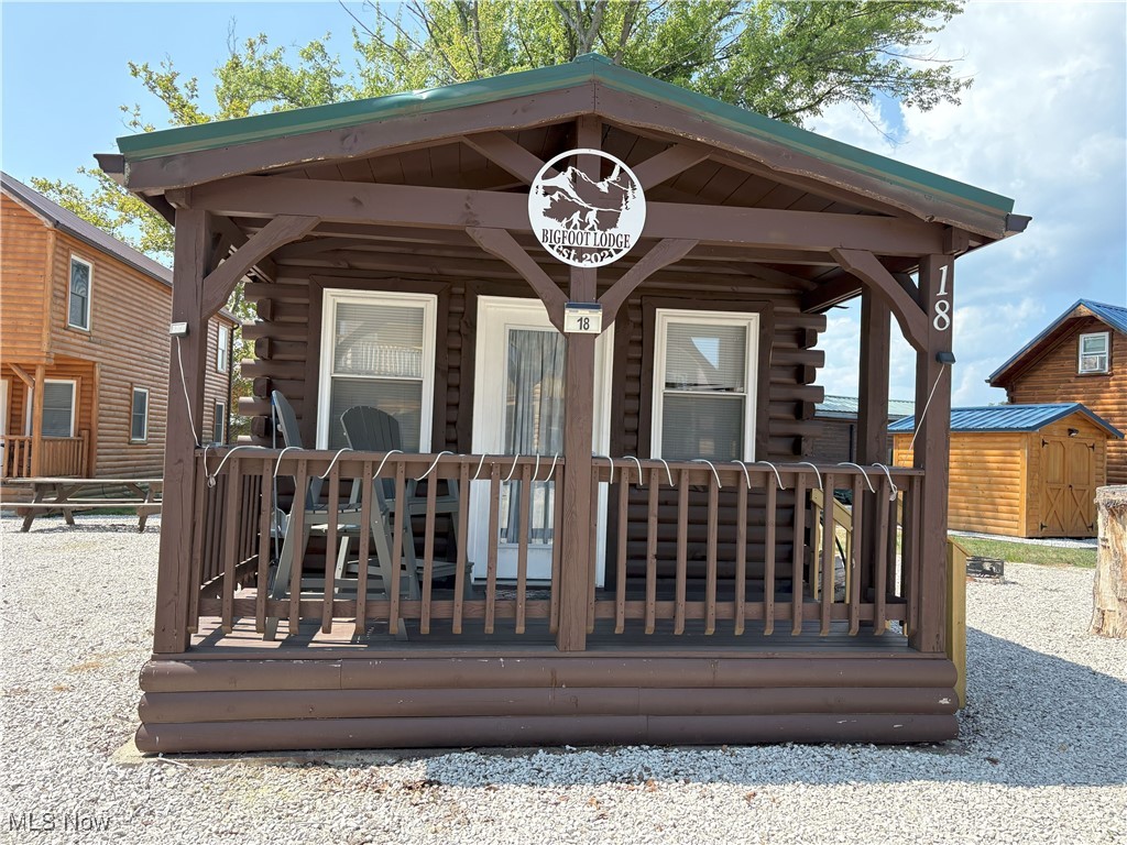Welcome to Bigfoot Cabin located in Cabins on the Lake association in Saybrook Township, Ohio on the Banks of Lake Erie.  Relax on the front porch and let your cares fade away.  This can be your perfect getaway or if you are thinking of investing look no further,  This property is currently making money as an Airbnb. Comes completely furnished. The Annual Rental fee of $1,000.00 is paid for 2026. Bigfoot is in a Peaceful area with steps down to the waters edge where you can enjoy beautiful sunsets or relax around the firepit.  Close to Historic Bridge Street shops and restaurants in the Ashtabula Harbor and also close to the strip at Geneva-On-The-Lake.