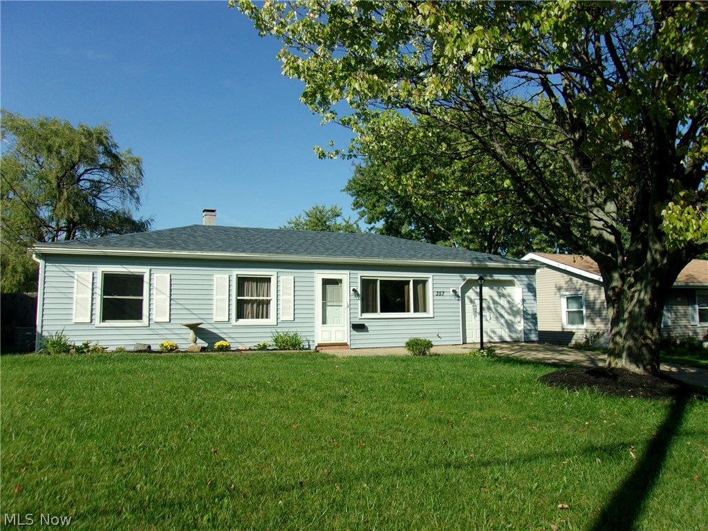 3 bedrooms 1 bath ranch w/1 car attached garage.  Kitchen has ample cabinets and enough room for a cafe table in the kitchen. There is laundry room off the garage entrance into home.  There is a wood burning stove in the dinning area very cozy for those cold winter nights.  Large deck off the back sliding doors and shed.  Located in a neighborhood with mature trees, sidewalks and close to shopping and restaurants.  Home does need a little TLC but well worth it. Roof complete tear-off and vinyl siding 2015. The garage door was also new 2015..