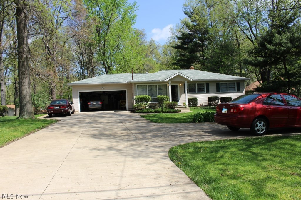 Many updates on this meticulously maintained ranch home in Stow.
Hardwood through out first floor except kithcen and dinning room.  3 bedrooms and 1 full bath with marble Jacuzzi bath tub and Laundry chute on first floor and 1 bonus room, 1 full bath and a large family room with fireplace on lower level. Corian kitchen countertops, stainless steel microwave, range, dishwasher and refrig erate , garbage disposal.  Bottom cabinets have newer pullout shelves and 2 pullout garbage buckets, plenty closets and storage space.  Newer furnace, humidifier and  newer roof, siding, flooring,concrete driveway and 2 extra packing spaces beside  attached oversized 2 car garage (expanded in the rear). Bright sunroom,  spacious deck over looking a yard of 0.72 acres. 
All of these locate at the highest spot of the street.  Close to schools, parks, and even restaurants.  A must see, don’t miss this one!