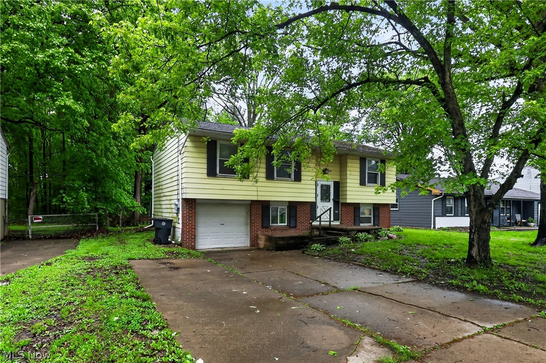 Take a look at this spacious home. The kitchen has a dining area and plenty of space for any family. The living room and 3 beds have hardwood flooring throughout. The bathroom is also a decent size. There's an exgtra living room in the basement that has a large brick fire place and another area that could be used as a play room, gaming area, or an office area. The attached garage is perfect for keeping you vehicle out of the elements. Come and make this your new home today!