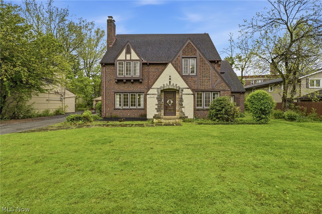 Welcome to this charming Tudor-style home in the heart of desirable Shaker Heights! This spacious 5-bedroom, 3.5-bath residence beautifully blends classic character with modern updates. The newly renovated kitchen features crisp white cabinetry, stainless steel appliances, and plenty of space for cooking and entertaining. Refinished hardwood floors flow throughout the dining room, living room, and upstairs bedrooms, adding warmth and elegance throughout the home. All full bathrooms have been completely remodeled with stylish tile flooring, fresh paint, and updated vanities, with a bathroom conveniently located on each level of the home. Additional highlights include a freshly paved blacktop driveway, newer roof, deck perfect for outdoor gatherings, and an attached 2-car garage. Located in one of the area’s most sought-after neighborhoods, this move-in-ready home offers comfort, style, and timeless appeal.